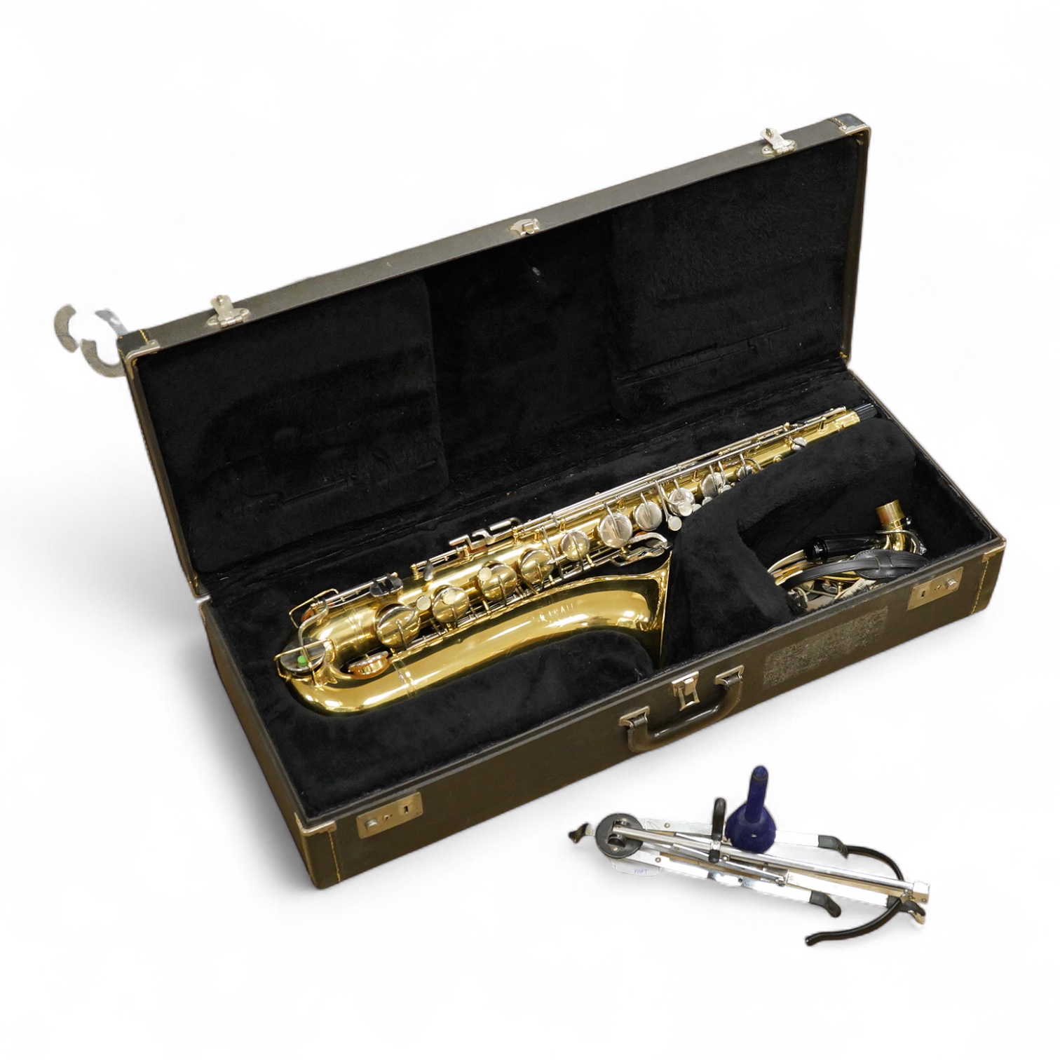 A cased Buescher Aristocrat tenor saxophone and stand